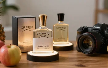 Creed Aventus luxury fragrance display featuring elegant bottle and fresh fruits.